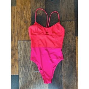 Summersalt Swan Dive one-piece in hibiscus + lava